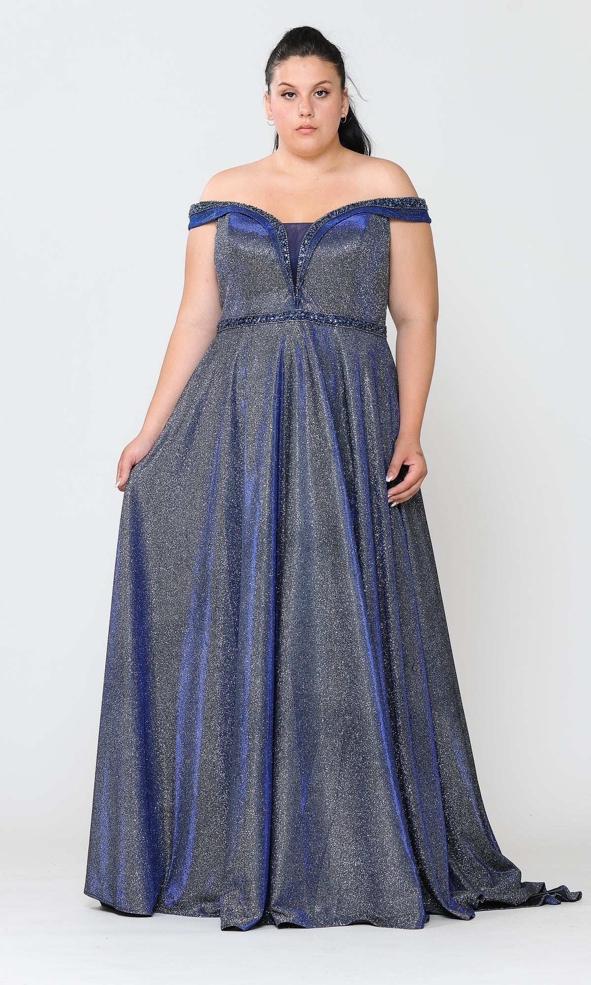 A woman models the Plus-Size Long Glitter-Knit Prom Dress W1096, a shimmery blue off-the-shoulder floor-length gown, standing against a plain light background.